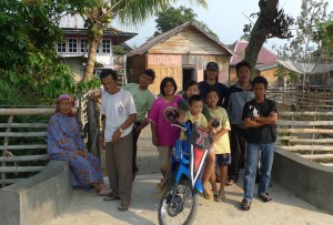 Joe in the field in Sumatra with coffee farmers (back row -- baseball cap).